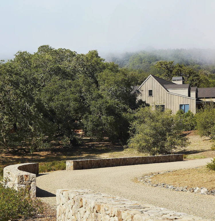 Curved stone wall around driveway in Sonoma